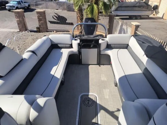 Slide: The Image of 2024 Tahoe Cascade Quad Lounge Windshield 25 FT boat interior with spacious seating. - 19