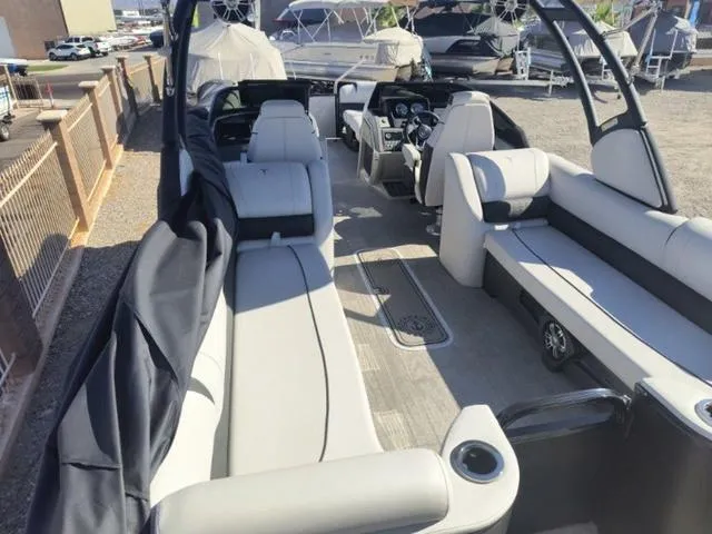 Slide: The Image of 2024 Tahoe Cascade Quad Lounge Windshield 25 FT boat interior with spacious seating and modern design. - 21