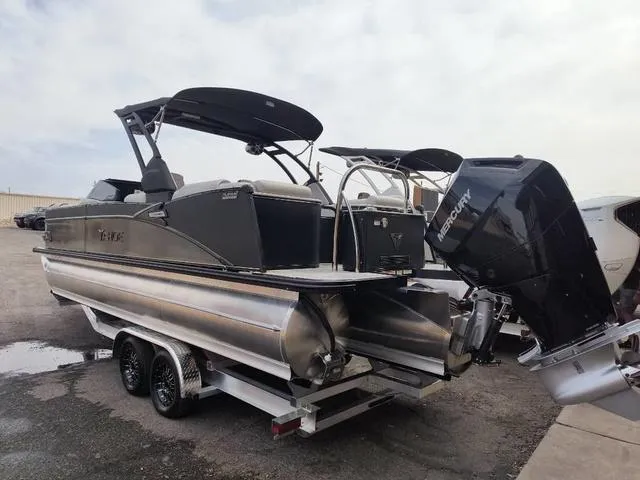 Slide: The Image of 2024 Tahoe Cascade Quad Lounge Windshield 25 FT pontoon boat with Mercury outboard engine. - 23