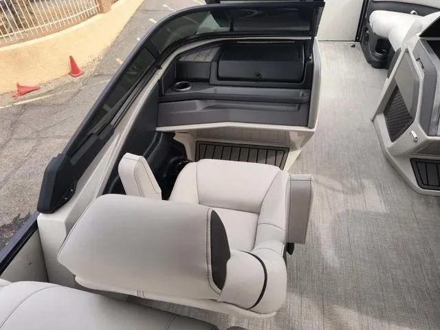 Slide: The Image of 2024 Tahoe Cascade Quad Lounge Windshield 25 FT interior with plush seating and modern design. - 26