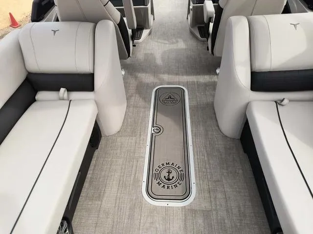 Slide: The Image of 2024 Tahoe Cascade Quad Lounge boat interior with luxurious seating and Germain Marine branding. - 27