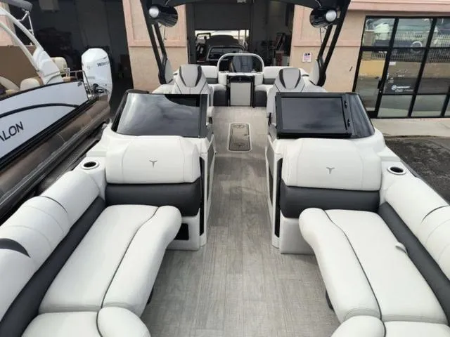 Slide: The Image of 2024 Tahoe Cascade Quad Lounge Windshield 25 FT boat interior with luxurious seating. - 30