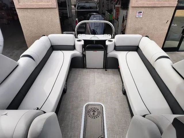 Slide: The Image of 2024 Tahoe Cascade Quad Lounge Windshield 25 FT interior with spacious seating and modern design. - 32