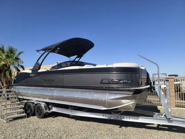Slide: The Image of 2024 Tahoe Cascade Quad Lounge Windshield 25 FT pontoon boat with outboard motor. - 4