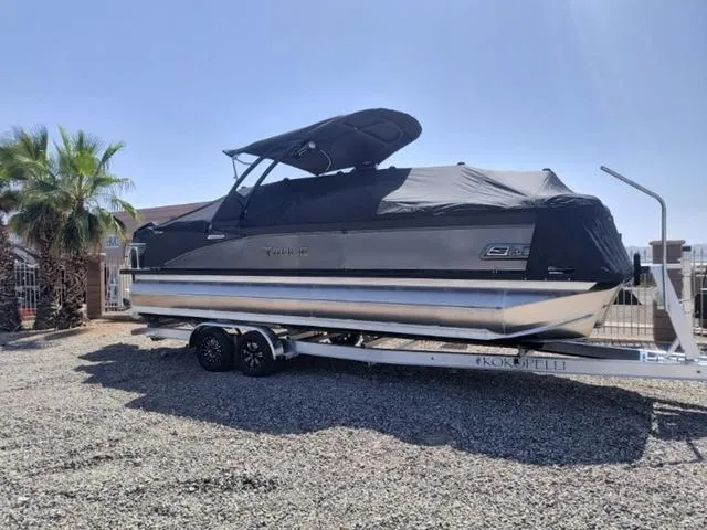 Slide: The Image of 2024 Tahoe Cascade Quad Lounge Windshield 25 FT boat cockpit with Garmin navigation system. - 5