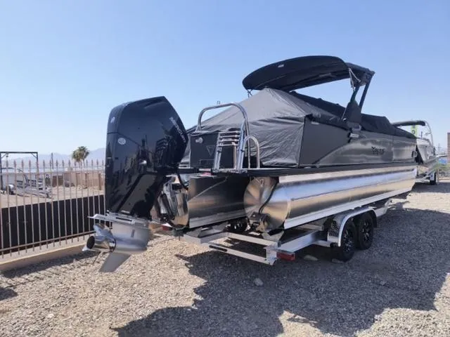 Slide: The Image of 2024 Tahoe Cascade Quad Lounge Windshield 25 FT pontoon boat with outboard motor. - 7