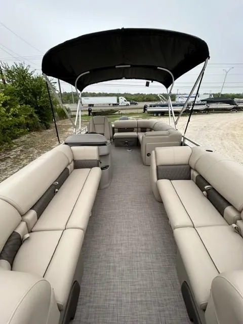 Slide: The Image of 2024 Sun Tracker Party Barge 20 DLX with spacious seating and canopy. - 4
