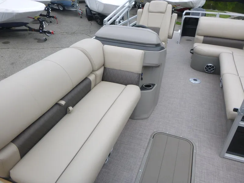 Slide: The Image of 2024 Sun Tracker Sportfish 24 XP3 pontoon boat interior with beige seating and modern design. - 15