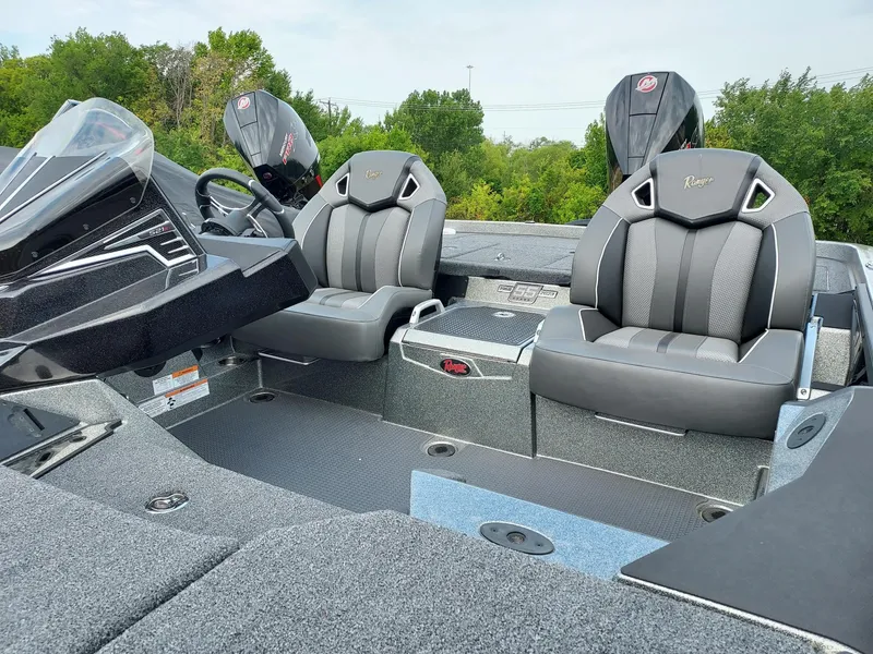 Slide: The Image of 2023 Ranger Z521R boat interior with sleek seating and modern dashboard. - 2