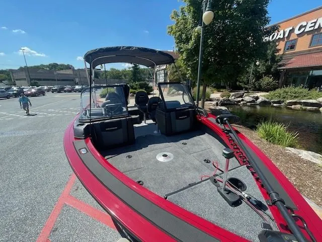 Slide: The Image of 2024 Tracker Targa V-19 WT boat in parking lot near boat center. - 2