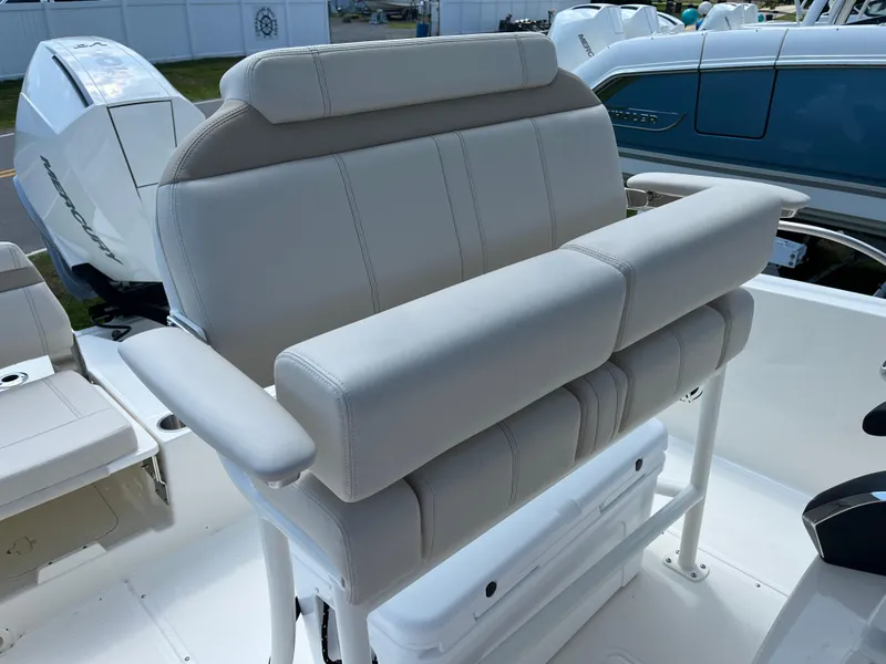 Slide: The Image of 2024 Boston Whaler 250 Dauntless boat seating with cushioned armrests. - 13