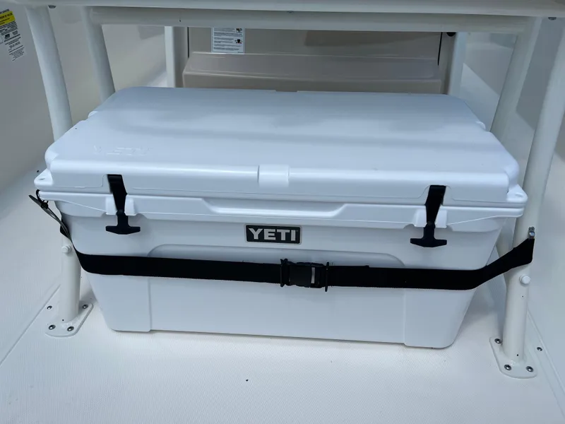 Slide: The Image of White YETI cooler secured on 2024 Boston Whaler 250 Dauntless boat. - 15