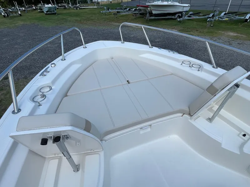 Slide: The Image of 2024 Boston Whaler 250 Dauntless boat bow seating area with cushioned seats. - 17