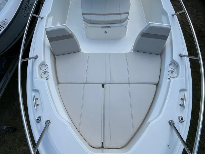 Slide: The Image of 2024 Boston Whaler 250 Dauntless boat bow seating area with cushioned seats. - 20