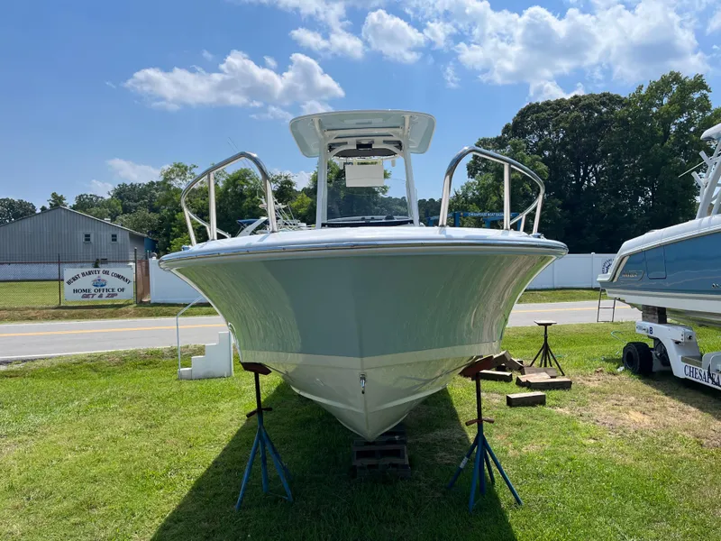 Slide: The Image of 2024 Boston Whaler 250 Dauntless boat on display outdoors. - 26
