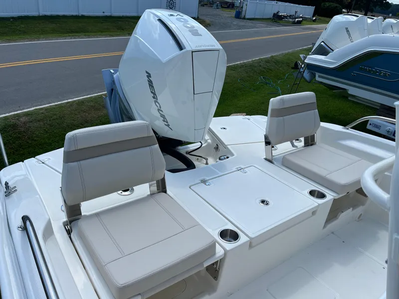 Slide: The Image of 2024 Boston Whaler 250 Dauntless boat with Mercury outboard engine and seating area. - 9