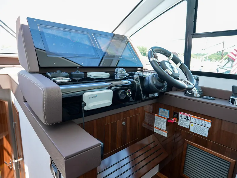 Slide: The Image of 2021 Cruisers Yachts 50 Cantius helm station with modern navigation equipment. - 34