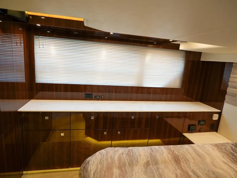 Slide: The Image of 2021 Cruisers Yachts 50 Cantius interior with polished wood cabinetry and marble countertop. - 46