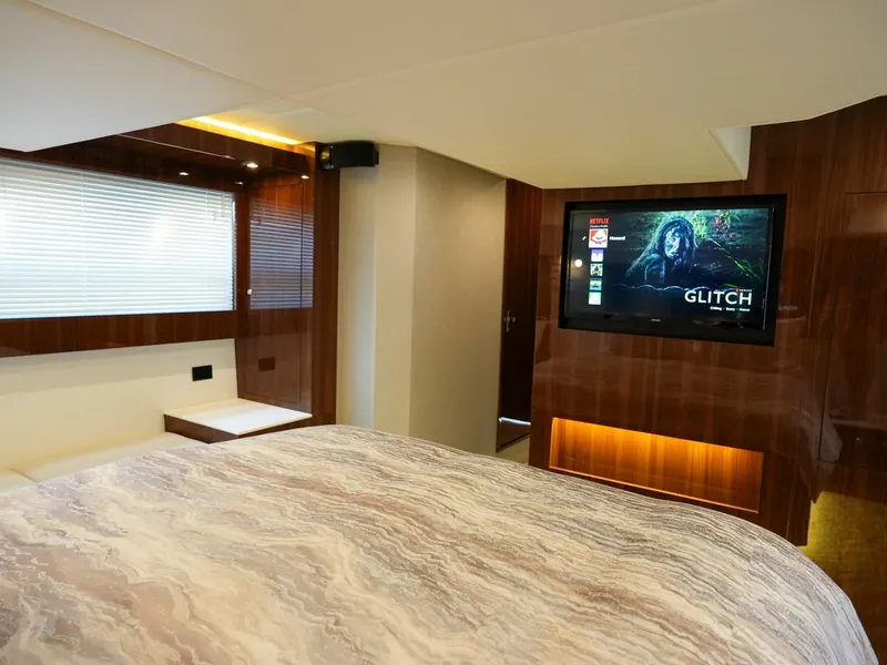 Slide: The Image of Luxurious bedroom in 2021 Cruisers Yachts 50 Cantius with TV and modern decor. - 48