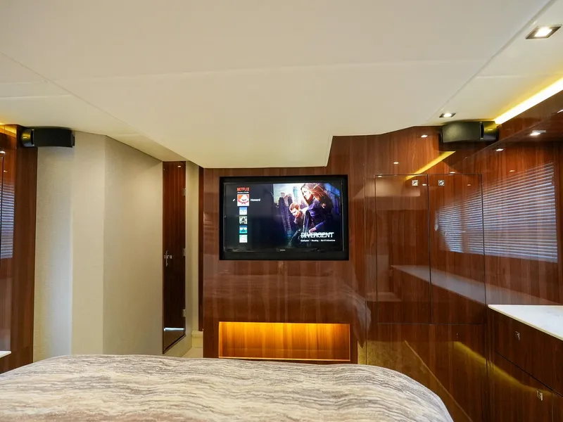 Slide: The Image of Luxurious bedroom interior of 2021 Cruisers Yachts 50 Cantius with mounted TV. - 49