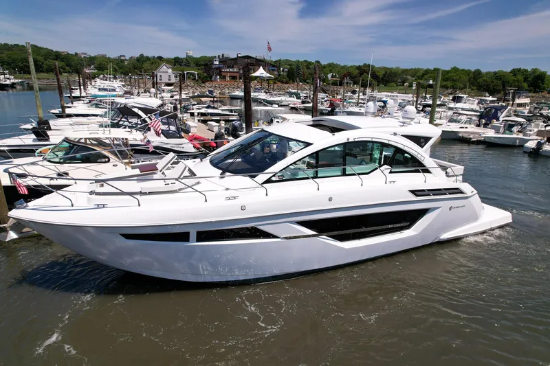 Slide: The Image of 2021 Cruisers Yachts 50 Cantius luxury boat docked in a marina. - 5