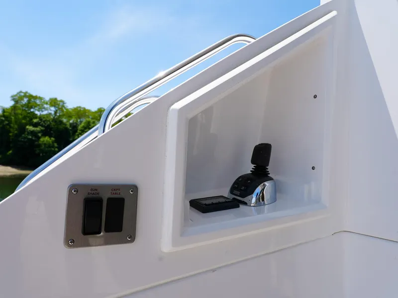 Slide: The Image of Control panel of 2021 Cruisers Yachts 50 Cantius with joystick and switches. - 8