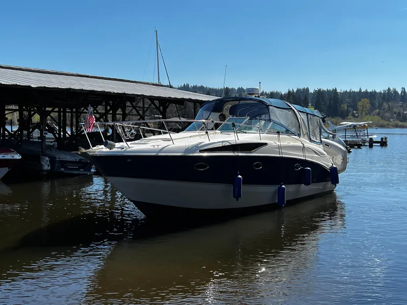 The Image of 2008 Bayliner 340 boat docked on a sunny day. - 0