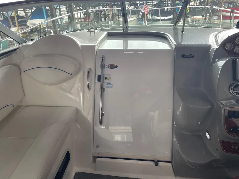 Slide: The Image of 2008 Bayliner 340 boat interior with seating and control panel. - 13