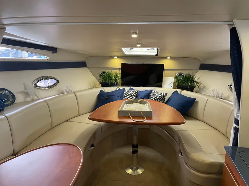 Slide: The Image of Interior of 2008 Bayliner 340 yacht with cozy seating and modern decor. - 16