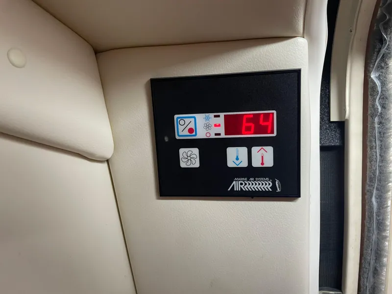 Slide: The Image of Digital control panel on a 2008 Bayliner 340 boat displaying 64 degrees. - 18