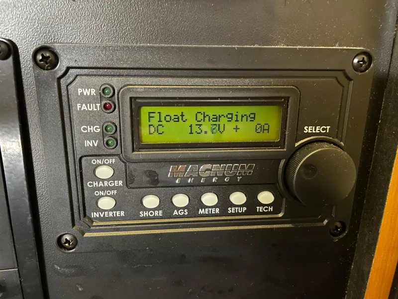 Slide: The Image of Magnum Energy charger display on 2008 Bayliner 340 showing float charging at 13.8V. - 30