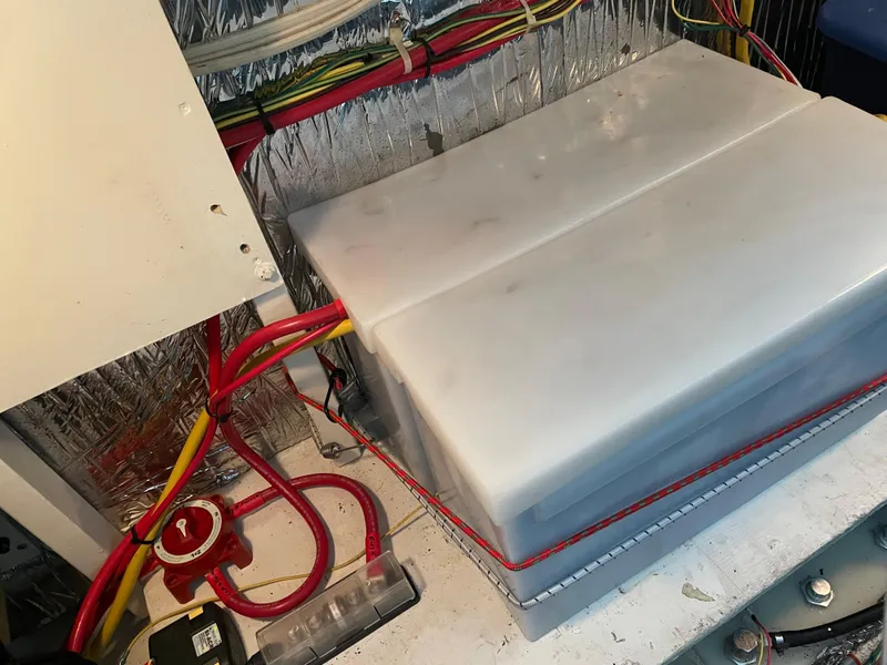 Slide: The Image of Battery compartment of a 2008 Bayliner 340 boat with wiring and insulation. - 39