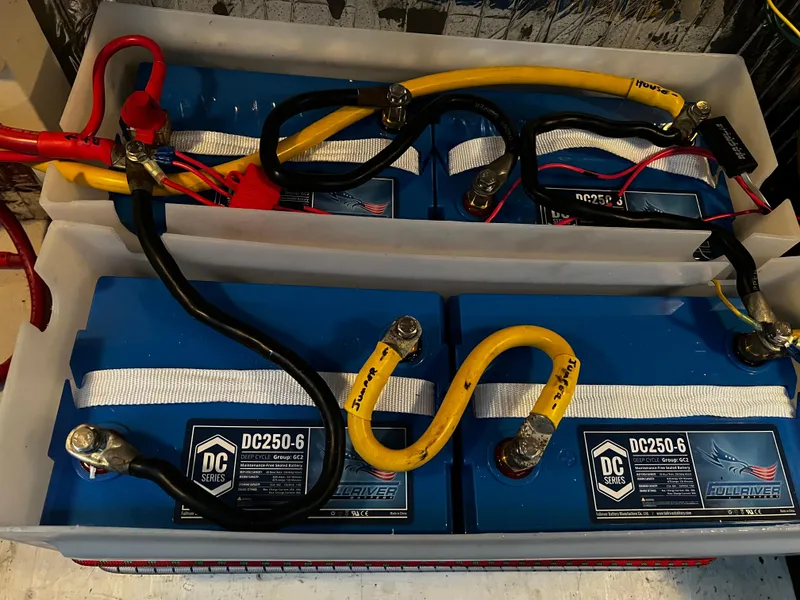 Slide: The Image of Battery compartment of a 2008 Bayliner 340 boat with DC250-6 batteries. - 40