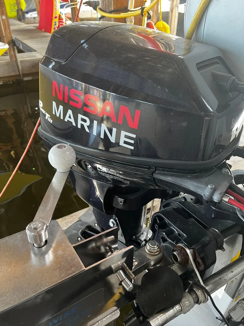 Slide: The Image of Nissan Marine outboard motor on a 2008 Bayliner 340 boat. - 46