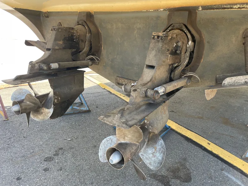 Slide: The Image of 2008 Bayliner 340 boat propellers and stern drives in dry dock. - 48
