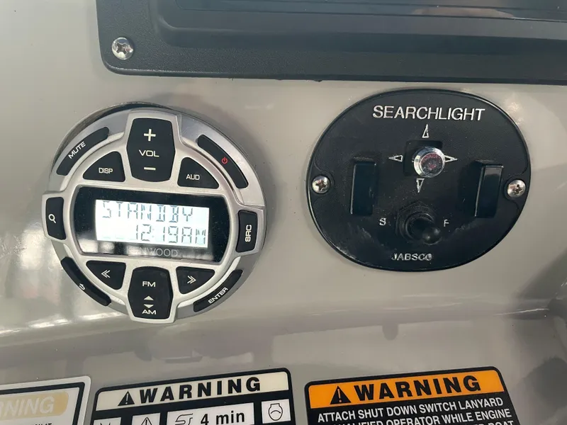 Slide: The Image of Control panel of a 2008 Bayliner 340 boat with searchlight and audio controls. - 8