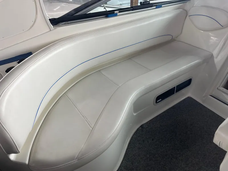 Slide: The Image of 2008 Bayliner 340 interior seating with white upholstery and blue trim. - 9