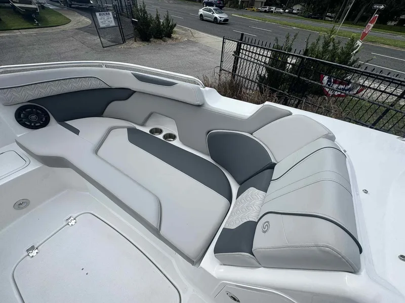 Slide: The Image of 2025 Hurricane SunDeck 2400 OB boat interior with stylish seating and cup holders. - 11