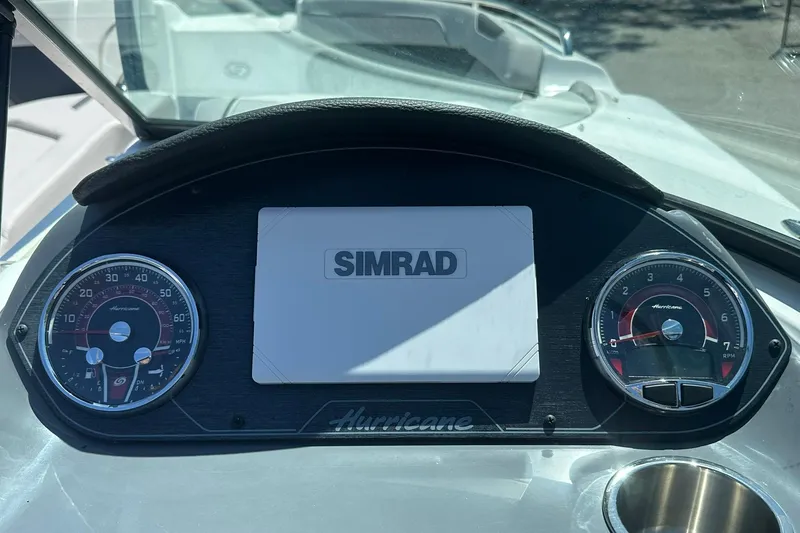 Slide: The Image of Dashboard of 2026 Hurricane SunDeck 2400 OB with Simrad display and gauges. - 17