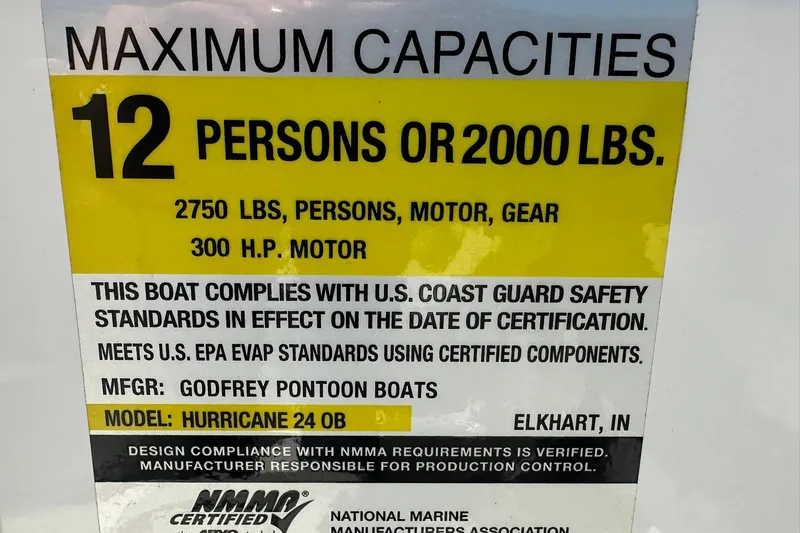 Slide: The Image of Capacity label for 2026 Hurricane SunDeck 2400 OB, 12 persons or 2000 lbs, 300 HP motor. - 21