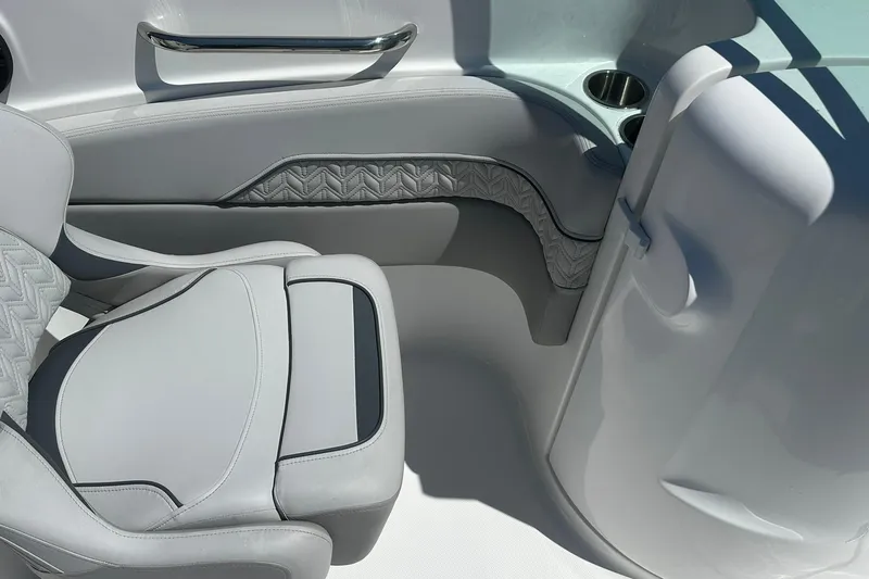 Slide: The Image of Interior of 2026 Hurricane SunDeck 2400 OB boat with sleek seating and cup holders. - 26