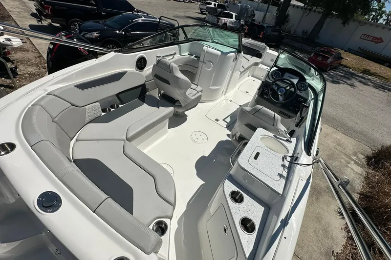 Slide: The Image of 2026 Hurricane SunDeck 2400 OB boat interior with spacious seating and modern dashboard. - 34