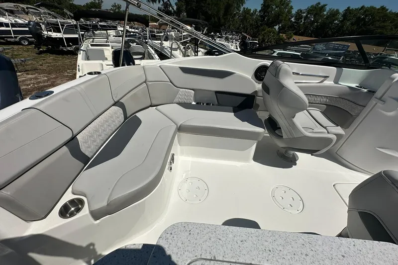 Slide: The Image of 2026 Hurricane SunDeck 2400 OB boat interior with spacious seating and modern design. - 35