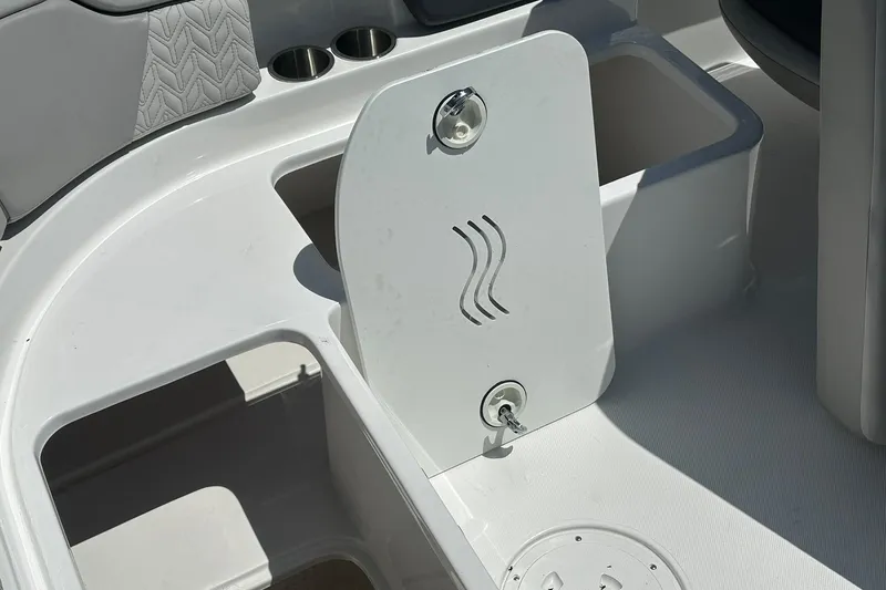 Slide: The Image of 2026 Hurricane SunDeck 2400 OB boat interior with seating and storage compartments. - 38
