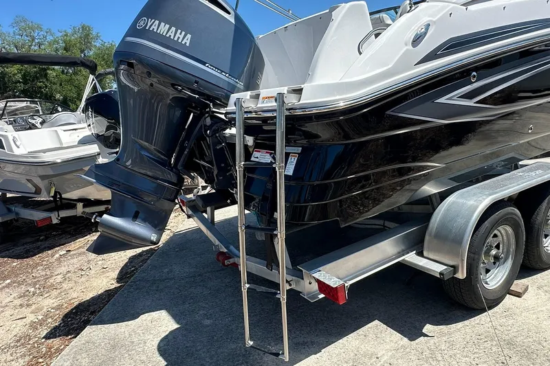 Slide: The Image of 2026 Hurricane SunDeck 2400 OB boat with Yamaha outboard motor on trailer. - 42