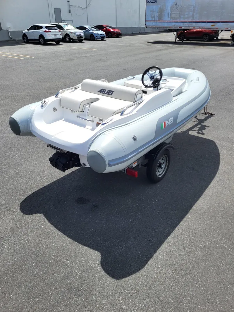 Slide: The Image of 2024 AB Inflatables ABJET 350XP on a trailer in a parking lot. - 12