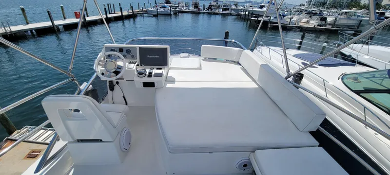 Slide: The Image of Flybridge of a 2013 Azimut 45 yacht with helm station and seating area. - 13