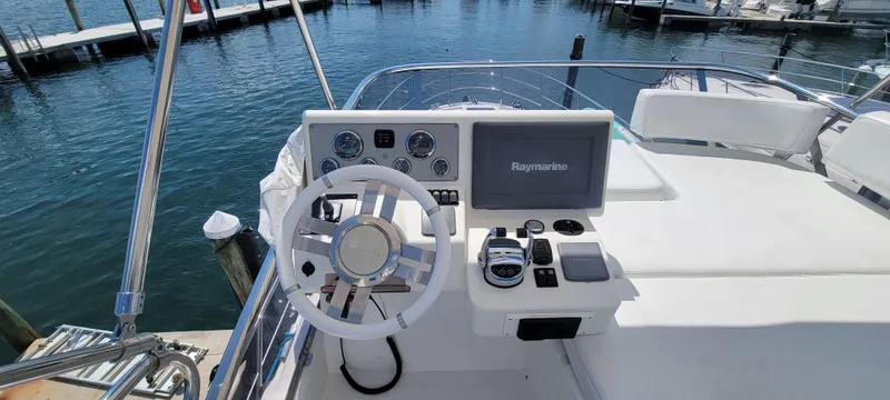 Slide: The Image of Flybridge helm of 2013 Azimut 45 yacht with Raymarine navigation system. - 14