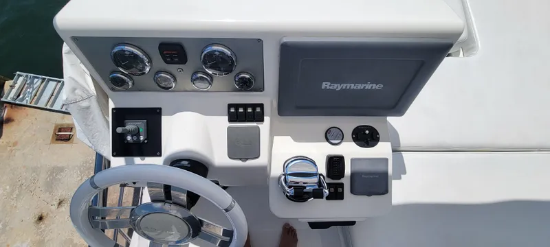 Slide: The Image of 2013 Azimut 45 Flybridge helm with Raymarine navigation system and control panel. - 15