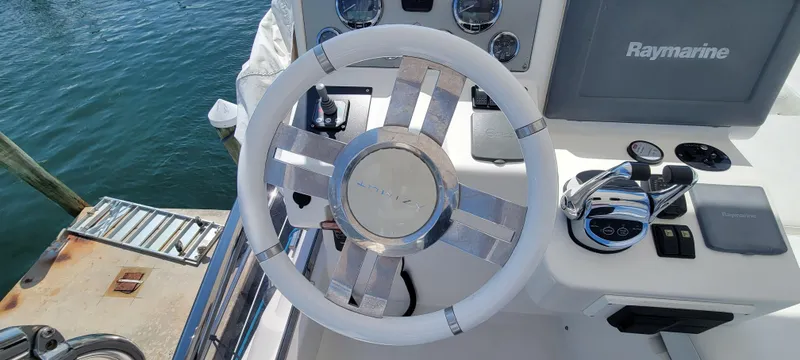 Slide: The Image of Steering wheel and controls of a 2013 Azimut 45 Flybridge yacht. - 16